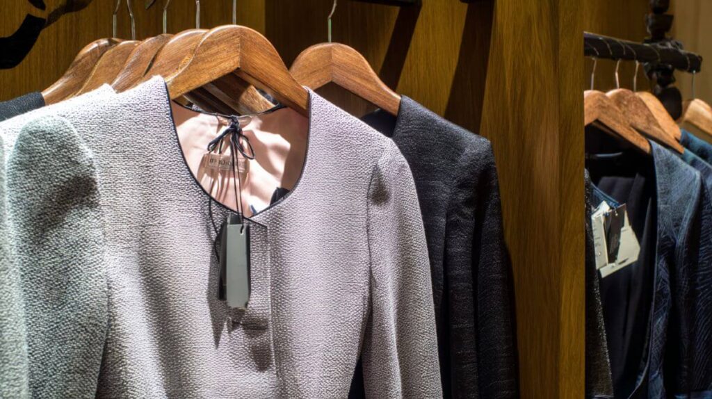 The One-Year Rule: What I Learned From Purging My Closet 2 Unworn designer blazer hanging in wardrobe with price tag attached